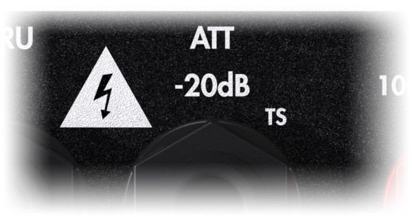 Close-up of the ATT -20dB TS speaker output with its lightning warning triangle